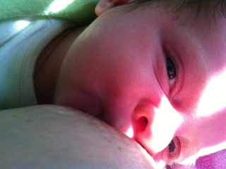 Smiling while breastfeeding
